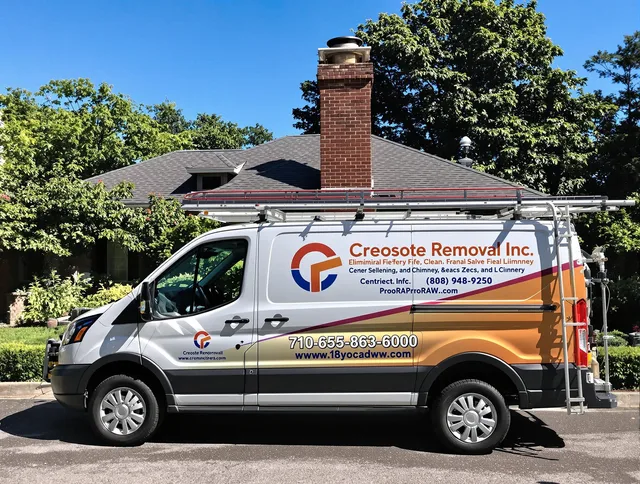 Stoneham Chimney Sweep technician removing creosote safely in Stoneham, MA