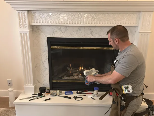 Stoneham Chimney Sweep performing fireplace maintenance in Stoneham, MA